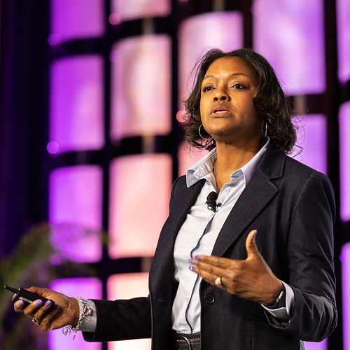 Woman speaking at MI Event Photo